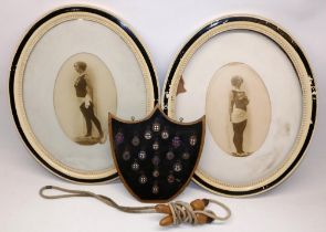 Collection of early 20th century silver and enamel gymnastics medals mounted on shield shaped board,