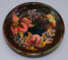 Moorcroft Pottery: 'Frilled Orchid' pattern plate, red and green flambe glaze, D21.5cm