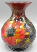 Moorcroft Pottery: 'Anemone' pattern vase globular vase with flared neck, red, green and blue flambe