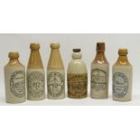 Collection of early 20th century stoneware ginger beer and stout bottles, predominantly North East