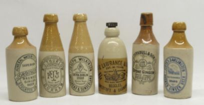 Collection of early 20th century stoneware ginger beer and stout bottles, predominantly North East