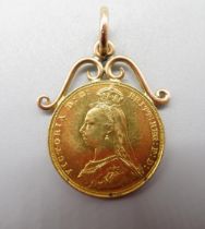 Victoria 1887 sovereign, attached to yellow metal scroll mount, 9.3g