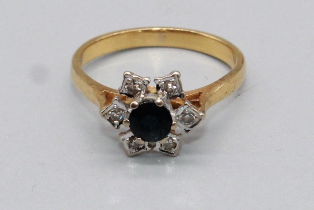 18ct yellow gold sapphire and diamond star cluster ring, stamped 18, size N, 3.2g