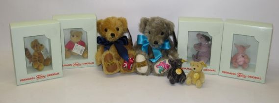 Collection of soft toys and teddy bears, comprising four Hermann 'Winnie the Pooh' miniature soft