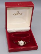 Ladies Omega gold wristwatch on matched gold hallmarked bracelet, signed silvered dial with