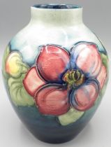 Moorcroft: 'Clematis' pattern ovoid vase, purple and pink flowers on graduated green ground, H13cm