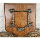 Unusual Edwardian oak wall mounted letter rack with hinged oak leaf and branch cast bracket, W25cm