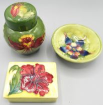 Moorcroft Pottery: 'Hibiscus' pattern rectangular trinket box and cover, red flowers on yellow