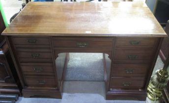 Victorian walnut kneehole desk, the nine drawers with angular brass handled on plinth base, W122cm