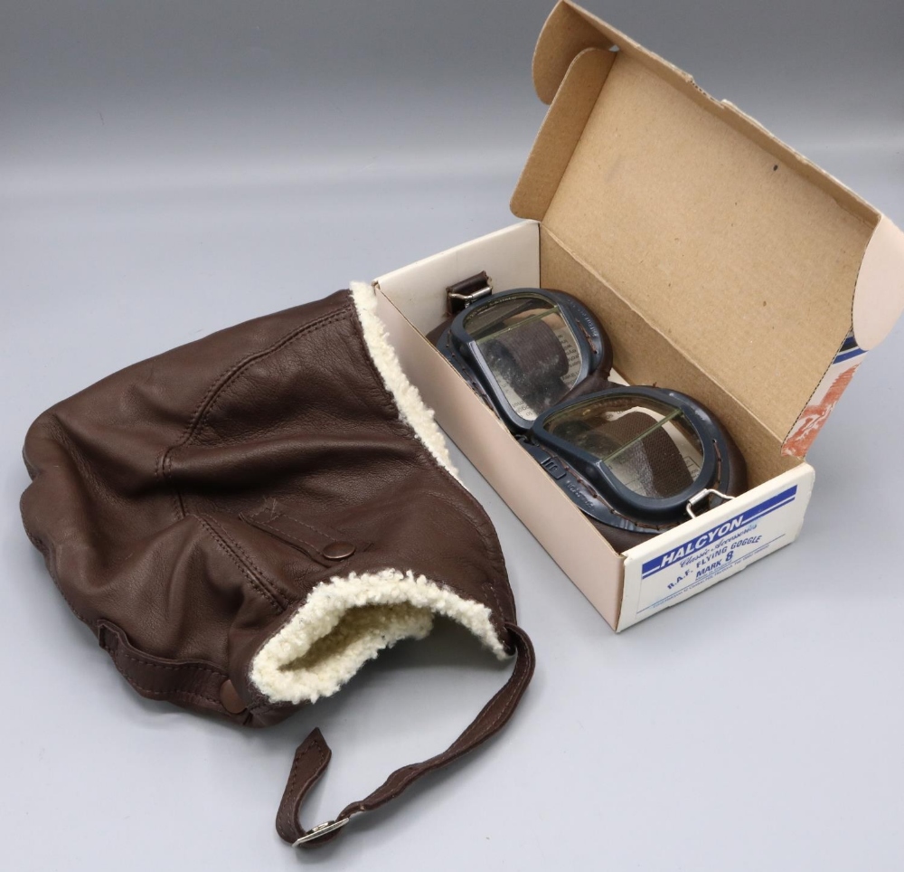 Late C20th sheepskin lined driving hat, and a pair of Halcyon Mark 8 motorcycle goggles (2)