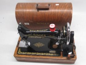 Singer hand sewing machine in dome top oak case, No.EA571619