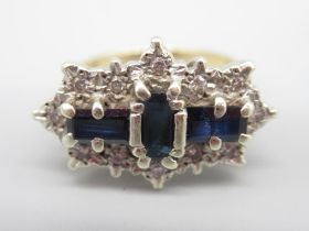 9ct yellow gold sapphire and diamond ring set with three baguette cut sapphires surrounded by