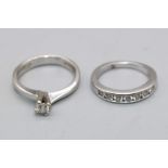White metal diamond solitaire ring, unmarked, size K1/2, and another unmarked white metal ring, 1/