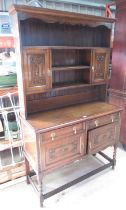 C20th oak dresser, twin shelf back with two cupboards above two further cupboards and two drawers,