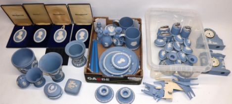 Large collection of Wedgwood blue jasperware incl. two clocks, two pairs of candlesticks, four table