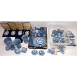 Large collection of Wedgwood blue jasperware incl. two clocks, two pairs of candlesticks, four table