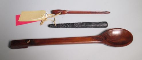 Large carved yew spoon, Irish black oak fishing priest and a Sailmakers needle, L47cm max (3)