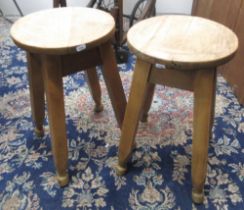 Pair of beech circular top kitchen style stools, H51cm