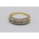 18ct yellow gold ring set with two rows of diamonds, stamped 750, size Q, 5.2g