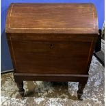 C19th mahogany dome top cellarette, outlined with satinwood band on ring turned tapered legs with