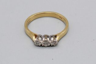 18ct yellow gold three stone diamond ring, stamped 750, size M, 2.8g