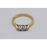 18ct yellow gold three stone diamond ring, stamped 750, size M, 2.8g