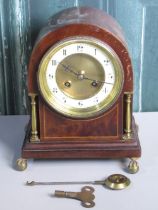 Edwardian inlaid mahogany arched top mantle clock with circular Arabic chapter, brass columns and