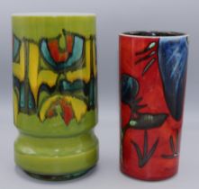 Poole Pottery vases: Delphis design vase, decorated in green, yellow and blue, and a Himalayan Poppy