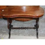 Victorian walnut centre table, shaped oval top on lyre end supports joined by turned stretcher,