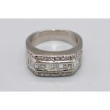 Gents 18ct white gold ring set with five square cut diamonds between rows of brilliant cut diamonds,