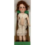 Early 20th century Armand Marseille bisque head doll, curled wig, white undergarments, marked 390n/