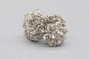18ct white gold double shooting star cluster ring, each star set with seven brilliant cut diamonds