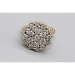 18ct yellow gold diamond cluster ring set with nineteen brilliant cut diamonds in illusion settings,
