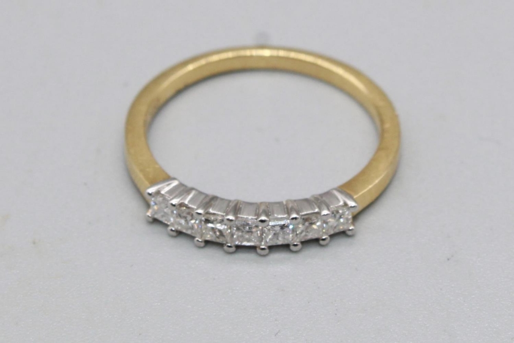 18ct yellow gold ring set with row of seven square cut diamonds, stamped 750, size M, 2.4g