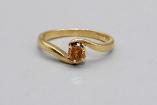 18ct yellow gold ring set with yellow diamond in crossover setting, stamped 750, size N1/2, 3.6g