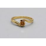 18ct yellow gold ring set with yellow diamond in crossover setting, stamped 750, size N1/2, 3.6g