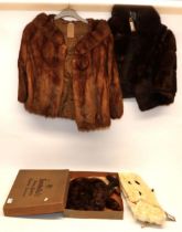 Brown mink stole, white ermin stole with tails, and two fur shrugs (4)