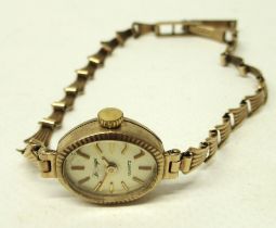 Ladies Sovereign gold quartz wristwatch on matching bracelet, signed champagne dial with applied