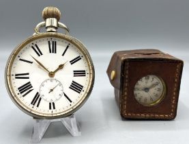 Junghans japanned steel and brass miniature travel alarm clock with original leather travel case,