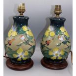 Moorcroft Pottery: pair of 'Hypericum' pattern table lamp bases, yellow flowers on graduated blue to