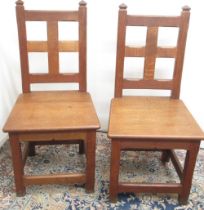 Pair of C20th oak Gothic style side chairs, with angular finials and faceted square open back, solid