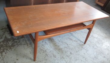 G-Plan style mid C20th teak rectangular coffee table on tapered supports, with magazine shelf