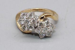 18ct yellow gold double floral cluster ring, each cluster set with seven brilliant cut diamonds in