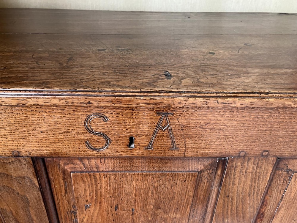 George III oak coffer, hinged plank top with moulded edge above four fielded panel front, carved - Image 2 of 3