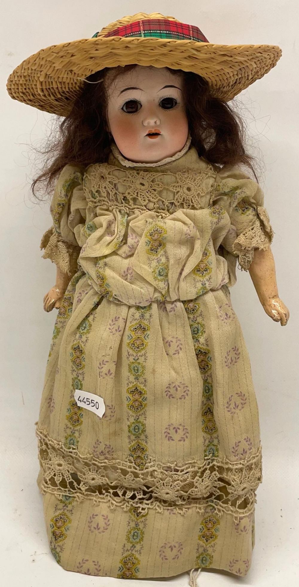 Early 20th century Schoenau & Hoffmeister bisque head doll, curled brown wig, Edwardian costume