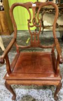 C20th Chinese hardwood armchair with solid seat and carved detail