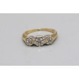 18ct yellow gold ring set with three diamond clusters, stamped 18, K1/2, 3.0g