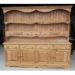 Large Country House style waxed pine dresser, twin shelf back with seven spice drawers, base with