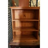 Small pine open bookcase with three shelves on plinth base, W70cm D37cm H89cm