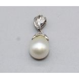 18ct white gold freshwater pearl drop necklace, the bail inlaid with baguette cut diamonds, the